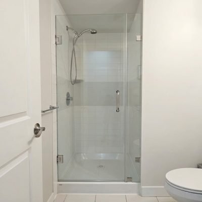Frameless swinging shower door