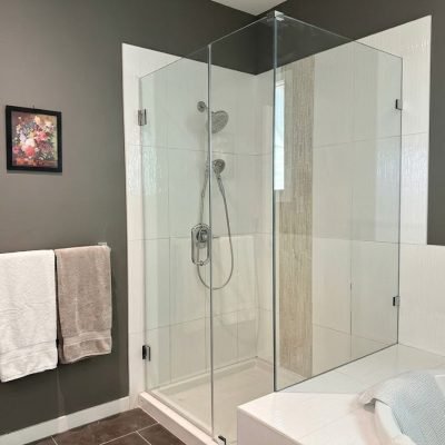 Corner frameless hinged shower door