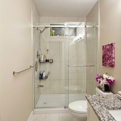Frameless Sliding shower glass door installed by VanGlaze